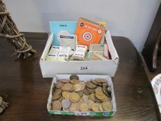 A mixed lot of British pre-decimal copper coins, tea, weetabix cards and Webley,