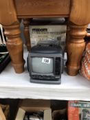 A boxed Maxim miniature black & white tv/radio