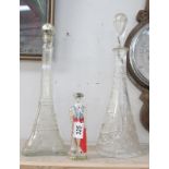 A tall cut glass decanter,