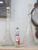 A tall cut glass decanter,