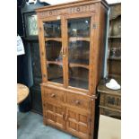 An oak glazed top dresser