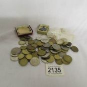 A mixed lot of foreign coins etc.