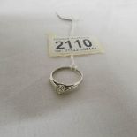 A 0.25 carat diamond ring marked 18ct fine platinum, size L.