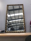 A gilt framed mirror