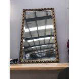 A gilt framed mirror