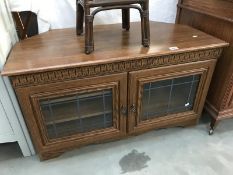 A dark oak effect television cabinet