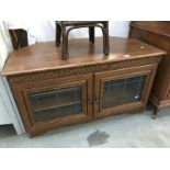 A dark oak effect television cabinet