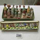 8 miniature Indian figures and a quantity of miniature bird figures.