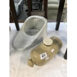 A stoneware hot water bottle and a slipper bath