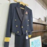 A military dress uniform with 2 miniature medals.