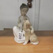 A Lladro girl with dog figure.