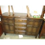 A dark wood sideboard,