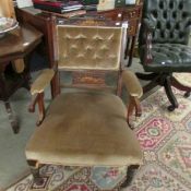 An Edwardian mahogany inlaid arm chair.