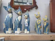 2 sets of graduated wooden cats