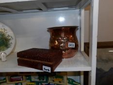 An art nouveau copper jardiniere and a carved wooden box.