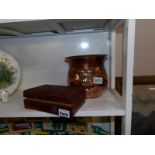 An art nouveau copper jardiniere and a carved wooden box.