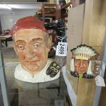 A Royal Doulton Williamsburg Bootmaker character jug and a Royal Doulton North American Indian jug,
