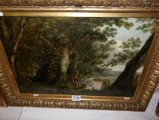 A framed oil on canvas painting of a period costumed man sat by a wooded waters edge, (unsigned,