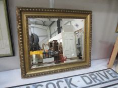 A gilt framed bevelled edged mirror