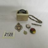 A silver watch fob, silver napkin ring etc.