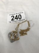 A diamond set heart 2 tone pendant on 9ct gold chain