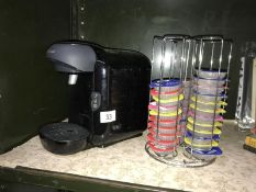 A Bosch Tassimo tea/coffee maker and pod rack with quantity of pods