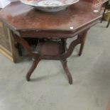 A mahogany octagonal occasional table.