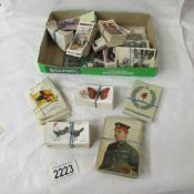 A mixed lot of cigarette cards including silks.