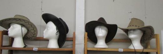 4 assorted cowboy hats (heads not included).