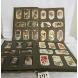 2 albums and a part album of cigarette cards.