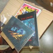 A box containing approximately 150 modern American comics.