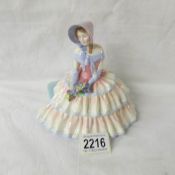 A Royal Doulton figurine, HN1731, Day Dreams.