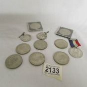 A mixed lot of coins and medallions etc.