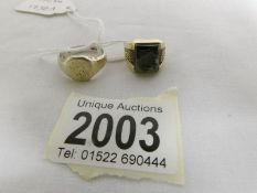 A 9ct gold signet ring, size M and a 9ct gold and silver signet ring, size P.