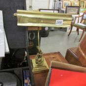 A brass desk lamp.