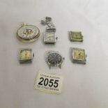 4 'Deco' watch heads, a Timex watch head and a contemporary pocket watch.