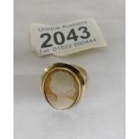 An oval ladies cameo ring in a gold mount of a female profile, dated Birmingham 1975,