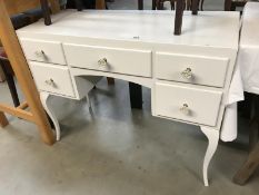 A 5 drawer painted cupboard