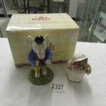 A boxed Royal Doulton Rupert the Bear character figure of Edward Trunk entitled 'Pretending to be