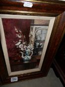 An oil on board still life of vase and dried flowers, signed Peter Brannan.