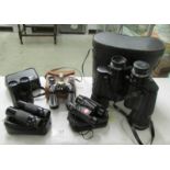 A cased pair of Prinzlux 10 x 50 binoculars and 4 others.
