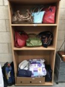 3 shelves of ladies handbags