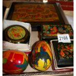 4 hand painted, signed and titled Russian lacquered boxes together with 2 painted lacquered eggs.