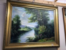 A large gilt framed painting countryside/lake