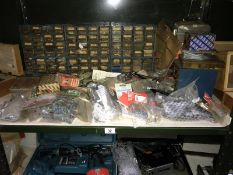 A shelf of storage boxes containing screws etc. & a quantity of miscellaneous packets etc.