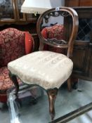 A Victorian oak chair.