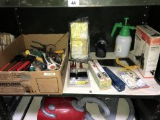 A box of assorted tools including soldering iron.