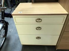 A 3 drawer bedside cabinet.