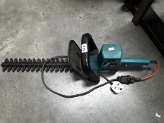 A Black and Decker hedge trimmer