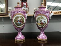 A pair of lidded vases.